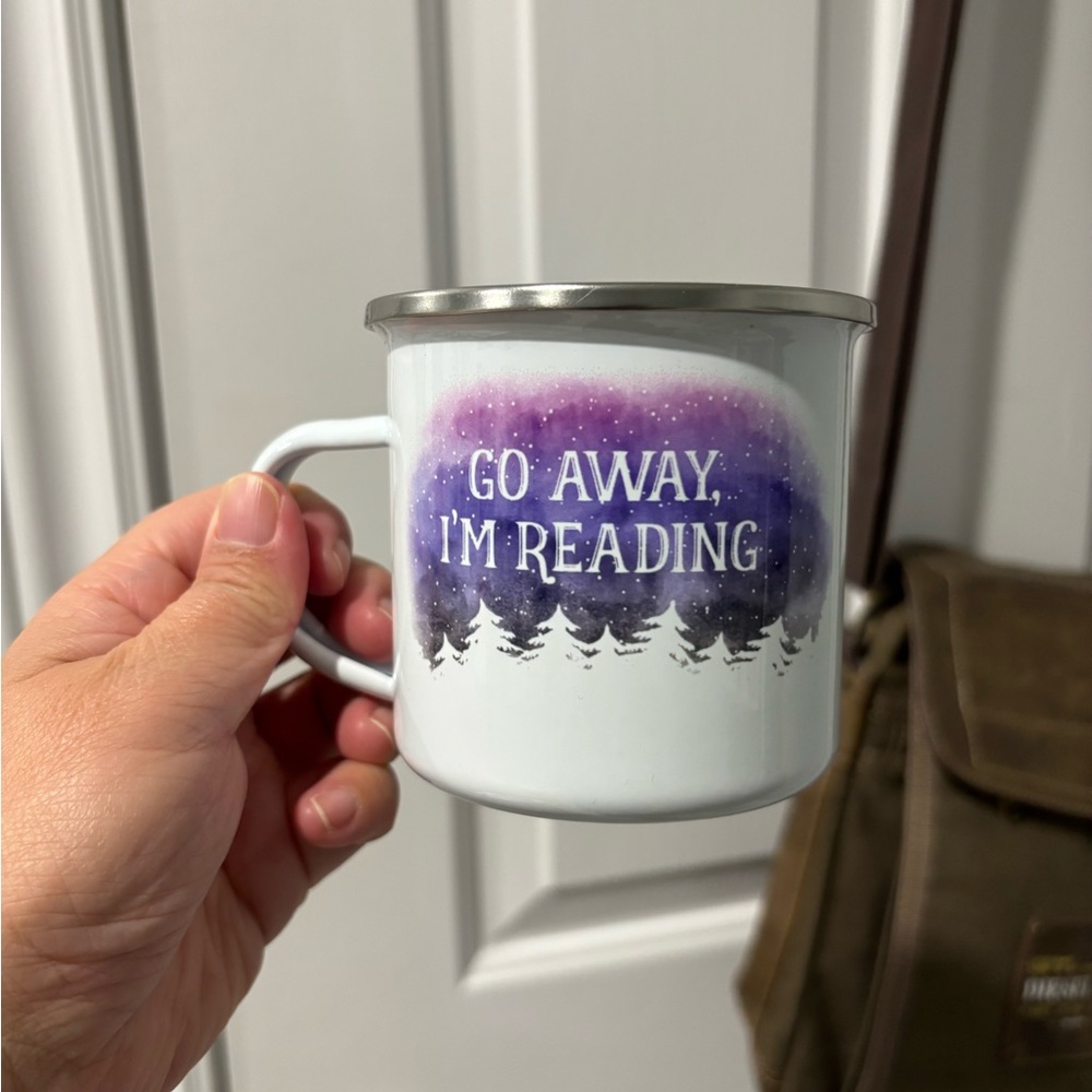 2/$10 Go Away, I'm Reading enamel mug features a watercolor-style design